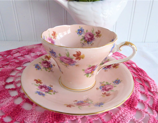 http://www.antiquesandteacups.com/cdn/shop/products/1950s-Aynsley-pink-peach-floral-chintz-corset-teacup-a_grande.JPG?v=1564880197