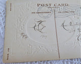 Postcard Christmas Greetings Embossed Snow Scene Holly 1909 Calligraphy