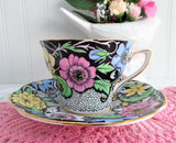 Dramatic Rosina Floral Cup And Saucer Hand Colored 1930s Black and Chintz Bands