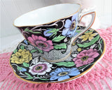 Dramatic Rosina Floral Cup And Saucer Hand Colored 1930s Black and Chintz Bands