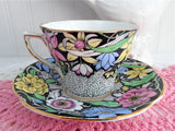 Dramatic Rosina Floral Cup And Saucer Hand Colored 1930s Black and Chintz Bands