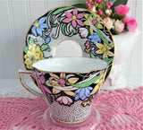 Dramatic Rosina Floral Cup And Saucer Hand Colored 1930s Black and Chintz Bands