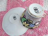 Dramatic Rosina Floral Cup And Saucer Hand Colored 1930s Black and Chintz Bands