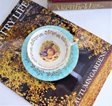 Aynsley Turquoise Cup And Saucer Fruit Center Gold Overlay 1940s