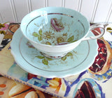 Pretty Paragon Cup And Saucer Robins Egg Blue Hand Colored Floral 1940s Platinum Trim