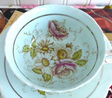 Pretty Paragon Cup And Saucer Robins Egg Blue Hand Colored Floral 1940s Platinum Trim