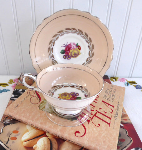 https://www.antiquesandteacups.com/cdn/shop/products/1940s-Paragon-peach-teacup-floral-platinum-d_large.JPG?v=1590677338