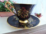 Elegant Black Cup And Saucer Metallic Gold Leaves Red Enamel Tuscan 1940s