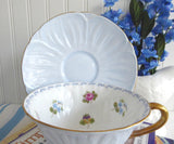 Shelley Footed Oleander Blue Rose Pansy FMNot Cup And Saucer Burnished Gold