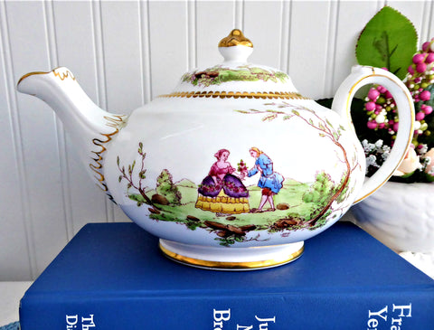 https://www.antiquesandteacups.com/cdn/shop/products/1950s-teapot-RoyalChelsea-hand-painted-18thc-design-a_large.jpg?v=1668188234