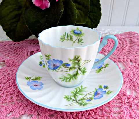 https://www.antiquesandteacups.com/cdn/shop/products/1960s-Shelley-BluePoppy-demiitasse-Ludlow-b_5399869e-6b1b-409f-b74c-0ecdab0de189_large.jpg?v=1663942770